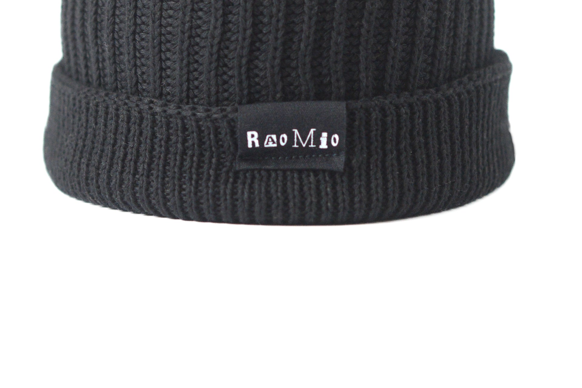 Versatile unisex black organic cotton beanie, one size fits all, combining eco-conscious fashion with everyday wear.