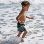 green short Miami Beach fun times kid in the water 
