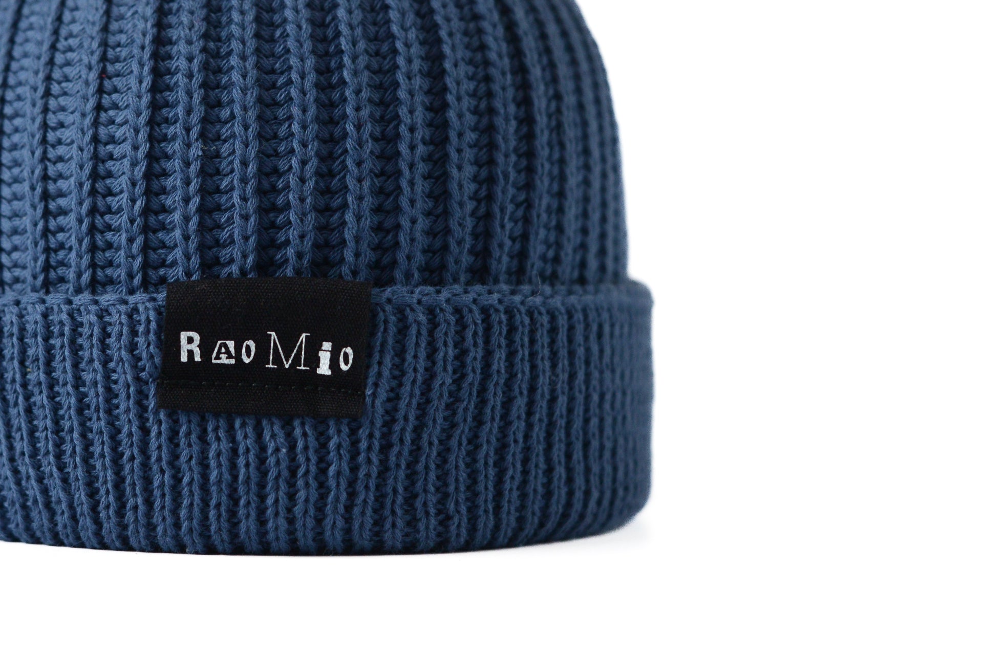 Chic blue organic cotton beanie, one size fits all, designed for eco-conscious individuals who value comfort.
