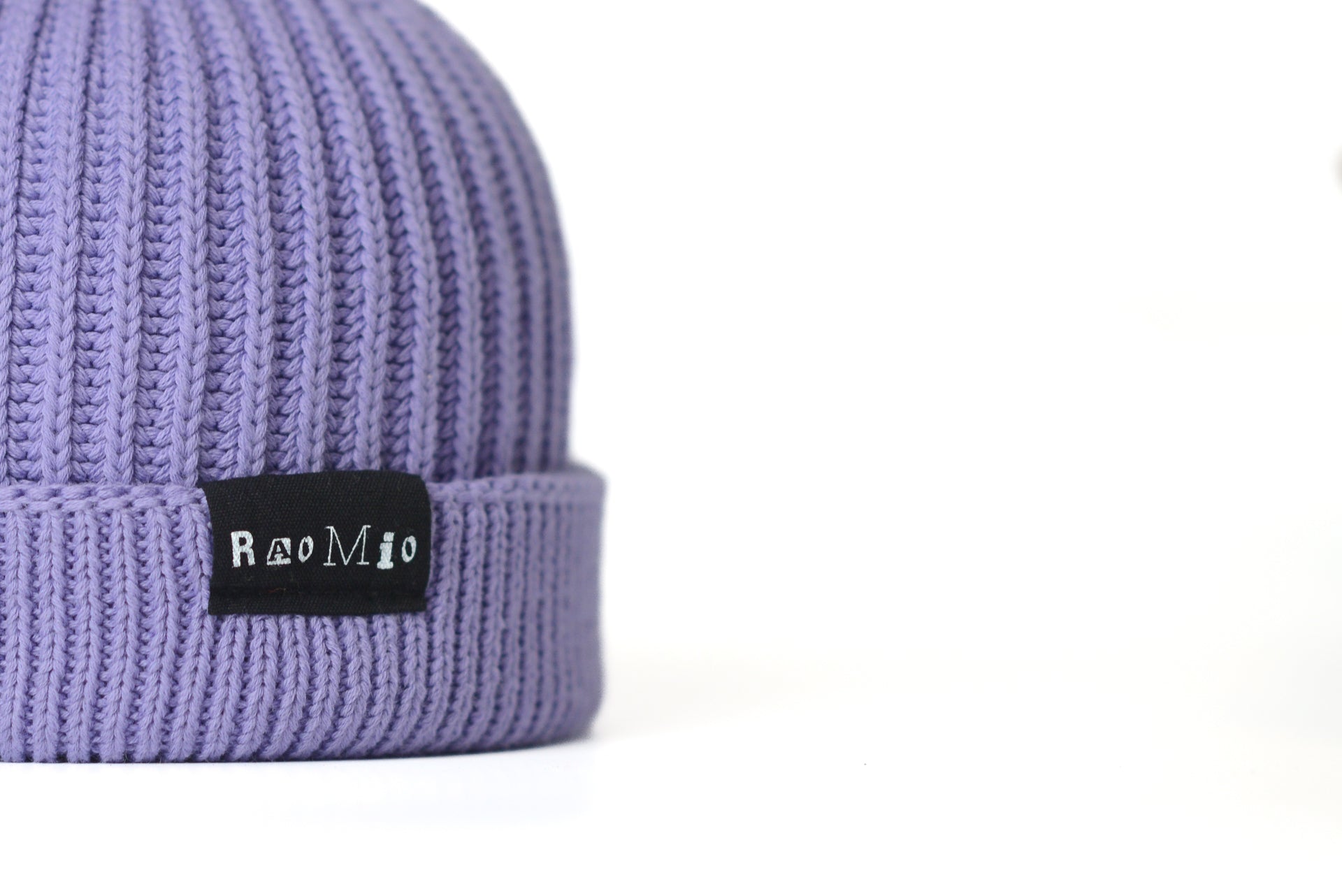 Vibrant purple organic cotton beanie, unisex design, one size fits all, for a sustainable and stylish look.