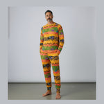 Man wearing a colorful patterned set against a plain background