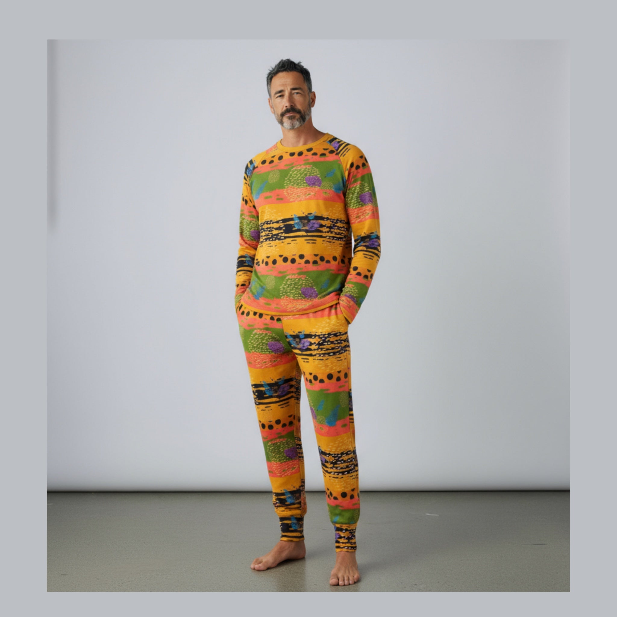 Man wearing a colorful patterned set against a plain background