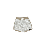 Beige shorts with zebra pattern on a white background